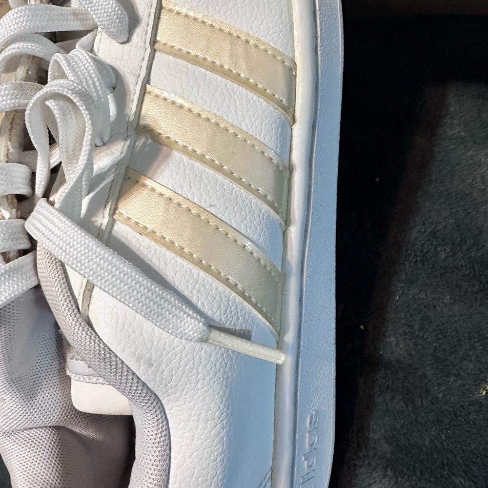 Adidas White Sneakers with Gold Stripes